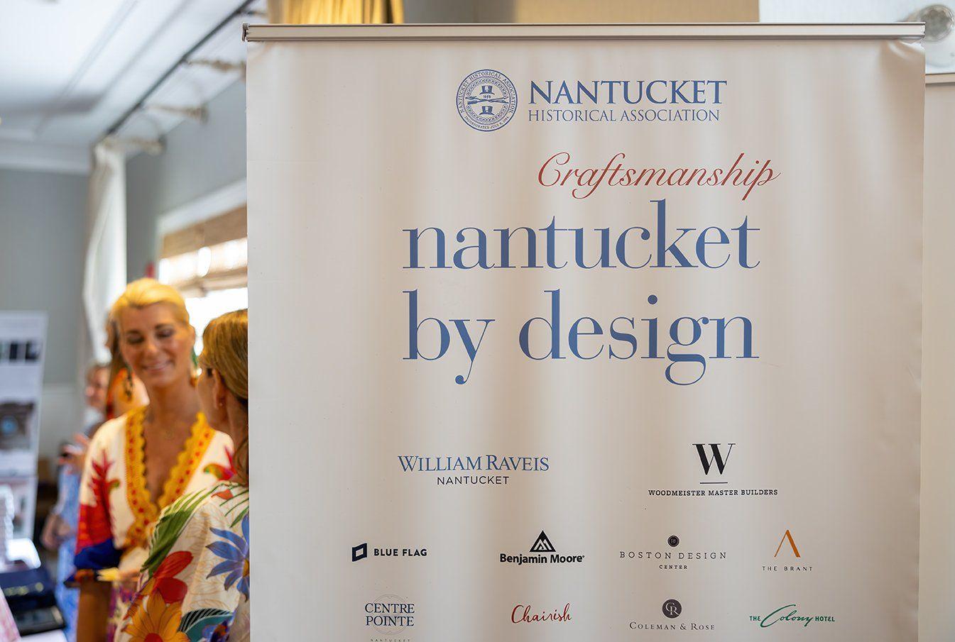 Nantucket by Design rollup sign with lady in background