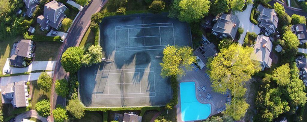 Ariel view of pool and tennis courts.